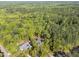 An aerial view showing the serene and secluded homesite nestled among lush trees at 4924 Theys Rd, Raleigh, NC 27606