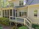Back exterior of home with screened porch and deck at 4924 Theys Rd, Raleigh, NC 27606
