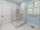 Stylish glass shower featuring subway tile and a built-in bench at 4924 Theys Rd, Raleigh, NC 27606