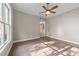 Bright and airy bedroom featuring hardwood floors and natural light at 4924 Theys Rd, Raleigh, NC 27606