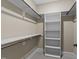 Walk-in closet featuring built-in shelving and hanging racks for optimal storage solutions at 4924 Theys Rd, Raleigh, NC 27606