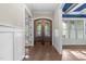 Welcoming foyer with a gorgeous wood double door and hardwood floors at 4924 Theys Rd, Raleigh, NC 27606