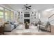Cozy living room with a fireplace, custom built-ins, and comfortable seating at 4924 Theys Rd, Raleigh, NC 27606