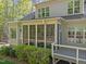 Enclosed screened porch and deck offer tranquil outdoor living at 4924 Theys Rd, Raleigh, NC 27606