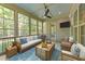 Comfortable screened porch furnished with stylish seating and a coffee table at 4924 Theys Rd, Raleigh, NC 27606