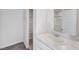 Well-lit bathroom showcasing marble countertops and a built-in storage space for optimal organization at 51 Landon Pl, Roxboro, NC 27573