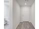 Bright entryway boasts neutral walls and gray wood flooring leading to the home's interior at 51 Landon Pl, Roxboro, NC 27573