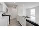 New kitchen with stainless steel appliances, modern white cabinets, and a marble countertop at 51 Landon Pl, Roxboro, NC 27573