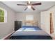 Cozy bedroom with modern furniture, and a window providing natural light at 6121 Kelvin Dr, Durham, NC 27712
