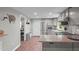 Kitchen view showcases stainless steel appliances, granite countertops, and an eat-in kitchen at 6121 Kelvin Dr, Durham, NC 27712