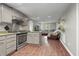 This eat-in kitchen features modern appliances, granite countertops, and hardwood floors, perfect for entertaining guests at 6121 Kelvin Dr, Durham, NC 27712