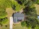 Aerial view of the home, showing the roof, driveway, and surrounding trees at 6907 Field Hill Rd, Raleigh, NC 27603
