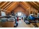 Unfinished attic space showing exposed rafters and beams, and lots of storage potential at 6907 Field Hill Rd, Raleigh, NC 27603