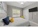Inviting bedroom featuring a plush bed, modern design, and an abundance of natural light at 6907 Field Hill Rd, Raleigh, NC 27603