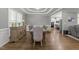 Open dining area features stylish furnishings and seamless flow to the adjacent kitchen space at 6907 Field Hill Rd, Raleigh, NC 27603