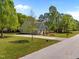 Exterior view of the home on a corner lot with a well-maintained lawn and mature trees at 6907 Field Hill Rd, Raleigh, NC 27603