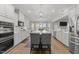 Bright kitchen featuring an island with seating and modern pendant lighting at 6907 Field Hill Rd, Raleigh, NC 27603