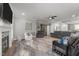Large living room with neutral colors, fireplace, mounted tv, plush furniture and lots of light at 6907 Field Hill Rd, Raleigh, NC 27603