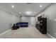 Spacious living room with gray walls, recessed lighting, plush carpet, and a comfortable navy blue sectional sofa at 6907 Field Hill Rd, Raleigh, NC 27603