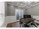 Office with stylish French doors, hardwood flooring, decorative molding, and large windows at 6907 Field Hill Rd, Raleigh, NC 27603