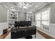 Bright office with custom built-ins, hardwood flooring, decorative molding, and large windows at 6907 Field Hill Rd, Raleigh, NC 27603