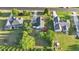 Aerial view of a two-story home with white siding and a gray roof, highlighting its spacious backyard at 72 Cokesbury Park Ln, Fuquay Varina, NC 27526