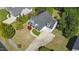 Aerial view of a two-story home with a gray roof, white siding, a front porch, and a well-kept yard at 72 Cokesbury Park Ln, Fuquay Varina, NC 27526