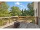 Back deck with wood railing and outdoor fire pit, perfect for entertaining at 72 Cokesbury Park Ln, Fuquay Varina, NC 27526