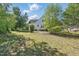Well maintained backyard with lush green grass and mature trees at 72 Cokesbury Park Ln, Fuquay Varina, NC 27526