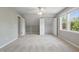 Spacious bedroom featuring plush carpeting, neutral paint, a closet, and natural light at 72 Cokesbury Park Ln, Fuquay Varina, NC 27526