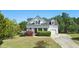 Charming two-story home featuring a well-manicured lawn and attached garage at 72 Cokesbury Park Ln, Fuquay Varina, NC 27526