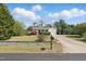 Charming two-story white home featuring a well-manicured lawn, a driveway, and a classic architectural style at 72 Cokesbury Park Ln, Fuquay Varina, NC 27526