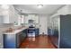 Modern kitchen with stainless steel appliances and stylish cabinets at 72 Cokesbury Park Ln, Fuquay Varina, NC 27526