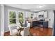 Bright kitchen with stainless steel appliances, ample counter space, and dining area at 72 Cokesbury Park Ln, Fuquay Varina, NC 27526