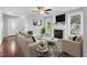 Bright living room with fireplace, large windows, and comfortable seating at 72 Cokesbury Park Ln, Fuquay Varina, NC 27526