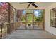 Relaxing screened porch with ceiling fan and wooded backyard view at 72 Cokesbury Park Ln, Fuquay Varina, NC 27526