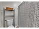 Cozy bathroom featuring a toilet and stylish black and white patterned shower curtain at 7383 Sandy Creek Dr, Raleigh, NC 27615