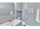 Stylish bathroom with a modern sink, toilet and decor at 7383 Sandy Creek Dr, Raleigh, NC 27615
