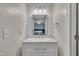 Bathroom with white vanity, white subway tile, and modern lighting fixtures at 7383 Sandy Creek Dr, Raleigh, NC 27615