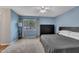 Serene bedroom with neutral carpet, large bed, and closet at 7383 Sandy Creek Dr, Raleigh, NC 27615