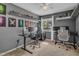 Bedroom with gray walls and a desk; perfect for a teen or gamer at 7383 Sandy Creek Dr, Raleigh, NC 27615