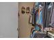 Organized walk-in closet with clothing racks and shelves for efficient storage at 7383 Sandy Creek Dr, Raleigh, NC 27615