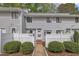 Charming townhome with white picket fence and manicured landscaping at 7383 Sandy Creek Dr, Raleigh, NC 27615