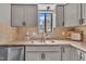 Close-up of the kitchen sink area, with granite countertops and stainless steel faucet at 7383 Sandy Creek Dr, Raleigh, NC 27615