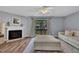 Cozy living room with a fireplace and access to the outdoor balcony at 7383 Sandy Creek Dr, Raleigh, NC 27615