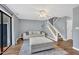 Spacious living room with a staircase and sliding door to the balcony at 7383 Sandy Creek Dr, Raleigh, NC 27615