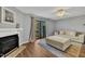 Comfortable living room with a fireplace and sliding door to the balcony at 7383 Sandy Creek Dr, Raleigh, NC 27615
