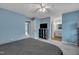Spacious bedroom with light blue walls and grey carpet provides a relaxing atmosphere at 7383 Sandy Creek Dr, Raleigh, NC 27615