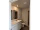 Bathroom featuring double sinks with marble countertops and tile flooring at 75 Landon Pl, Roxboro, NC 27573
