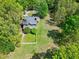 Aerial view of home with a well-maintained lawn and white picket fence in the backyard at 8120 Stillbreeze Dr, Fuquay Varina, NC 27526